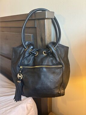 Michael Kors black leather shoulder bag with gold accents